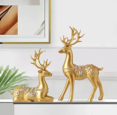 Duo Cerfs Dorés - Élégance MaisonDuo de Statuettes Cerfs Royaux : Élégance et Prestige Doré pour votre Intérieur